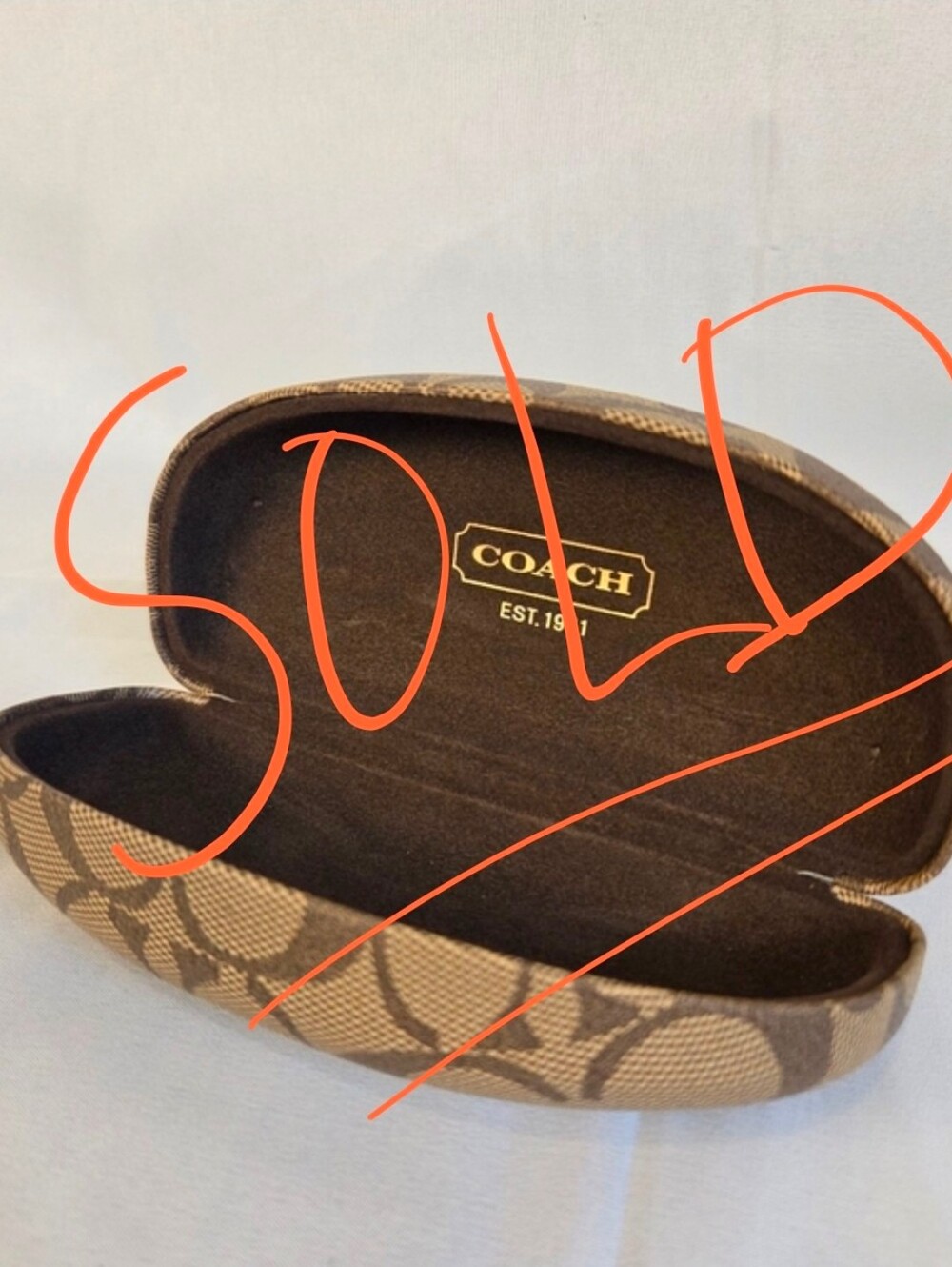 Classic Coach signature C design eyeglass/sunglasses case in brown and tan.